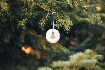 Christmas decoration on fir tree. Christmas lights backgroundの写真素材