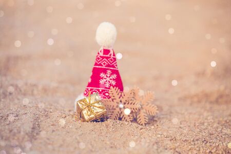 Santa hat on the beach sandの写真素材