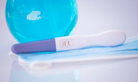 Positive pregnancy test in coronavirus pandemicの写真素材