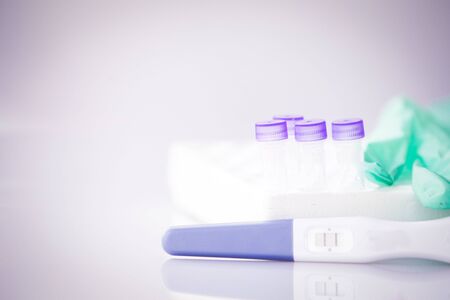 Positive pregnancy test in coronavirus pandemicの写真素材