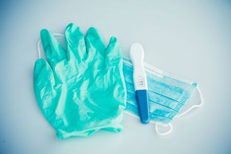 Positive pregnancy test in coronavirus pandemicの写真素材