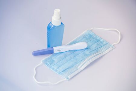Positive pregnancy test in coronavirus pandemicの写真素材