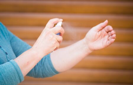 Woman with hand disinfection gelの写真素材