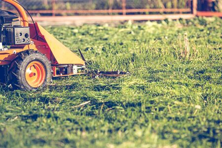 Professional lawn mower cutting grassの写真素材