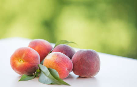 Organic cultured ripe peach fruitsの写真素材