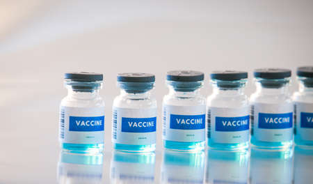 Covid 19 vaccine bottles medical backgroundの写真素材