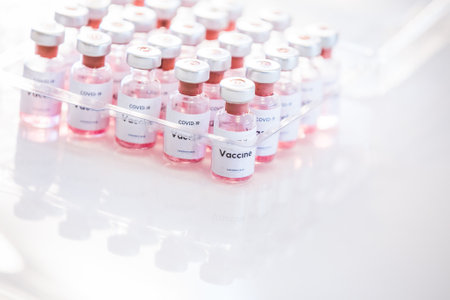 Covid 19 vaccine bottles medical backgroundの写真素材