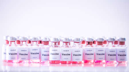 Covid 19 vaccine bottles medical backgroundの写真素材