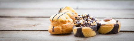 Homemade cakes on wooden backgroundの写真素材