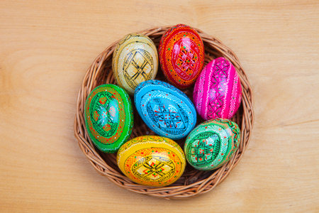 Colorful Easter eggs on wooden background. Happy Easter. Space for text.の写真素材