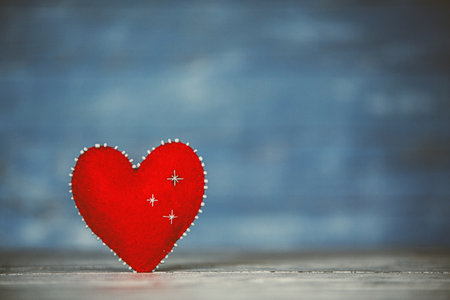 Valentines day. Valentines day greeting card. Heart on a wooden background. Heart of love.の写真素材