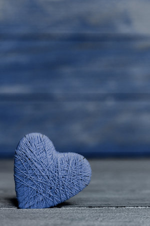 Valentines day. Valentines day greeting card. Heart on a wooden background. Heart of love.の写真素材