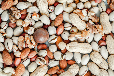 Assorted nuts for a background Almond, walnut,cashew, pistachios, hazelnuts, peanuts, Macadamiaの写真素材