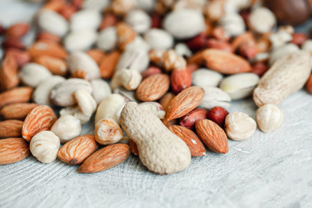 Assorted nuts for a background Almond, walnut,cashew, pistachios, hazelnuts, peanuts, Macadamiaの写真素材