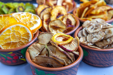 Organic Healthy Assorted Dried Fruit Mix close up. Dried fruit snacks. dried apples, mango, feijoa, dried apricots, prunes top viewの写真素材