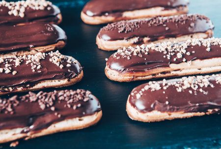 Traditional french eclairs with chocolate. Tasty dessert. Home made cake eclairs. Sweet Dessert...