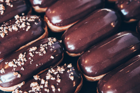 Traditional french eclairs with chocolate. Tasty dessert. Home made cake eclairs. Sweet Dessert...