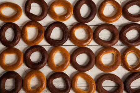 Stacked Freshly Baked Bread Bagels. Fresh bagels on rustic wooden background