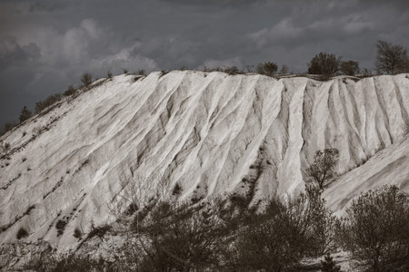 Abandoned limestone quarry. Interesting form of relief. Amazing hills and ground. Dry areas of the earth. Global warmingの写真素材