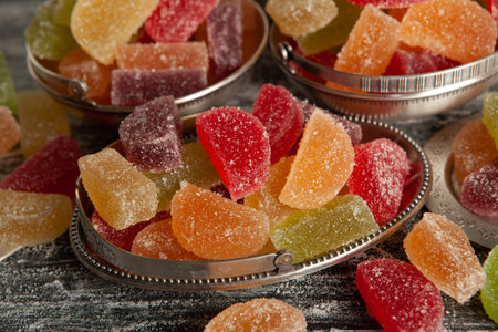 Dessert marmalade in the form of lemon and orange slices. The sweetness of jelly candy.の写真素材