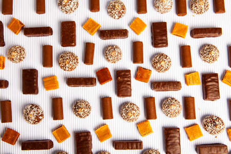 Assortment of delicious chocolate candies background. Chocolate candy isolatedの写真素材