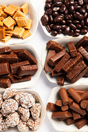 Assortment of delicious chocolate candies background. Chocolate candy isolatedの写真素材