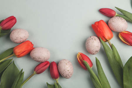 Hand painted pastel colored Easter eggs background. Happy Easter greeting card or invitation.の写真素材