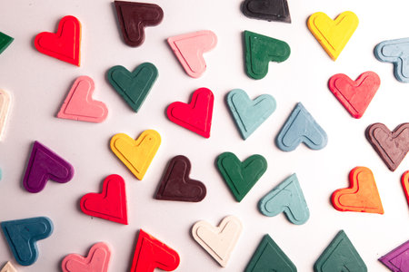Colorful plastic hearts on a white background. Valentine's Day.