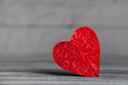 Red heart on a wooden background. Valentine's day. Copy space.