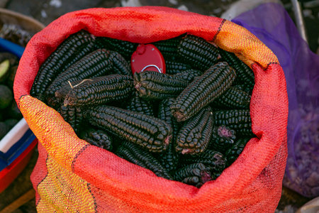 Basket of black corn on the market in India. Close up