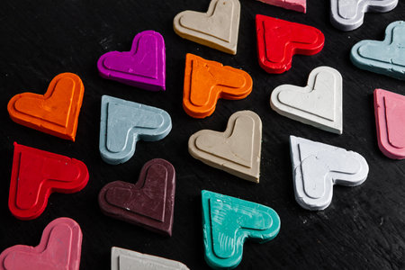 Colorful plasticine hearts on a black background, Valentine's Day