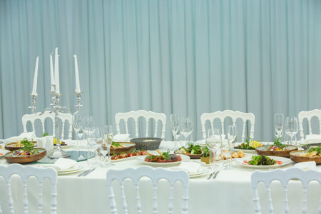 wedding banquet table with food and cutlery, selective focus