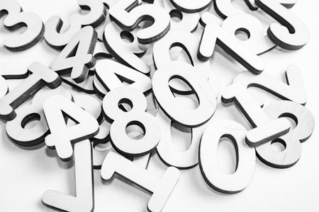 Numbers on a white background, close-up. Monochrome.の写真素材