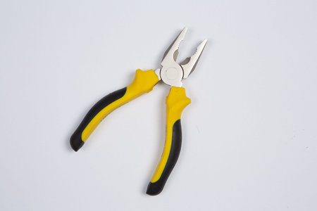 Pliers on a white background. The concept of repair work.