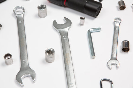 Wrenches and other tools on a white background. Top view.