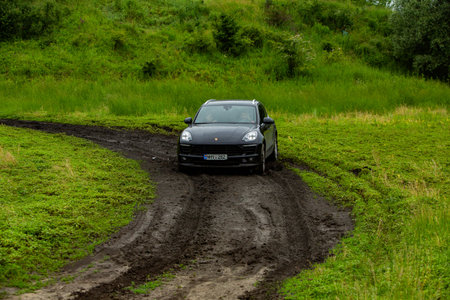 Porsche Macan S in off-road racing full of mood on bad road in Moldova.