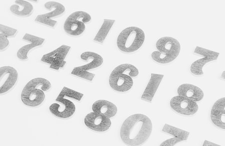 White background with numbers. Close-up of numbers. White background.の写真素材