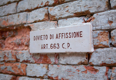 Direction sign on a brick wall with the text Dont forget to askの写真素材