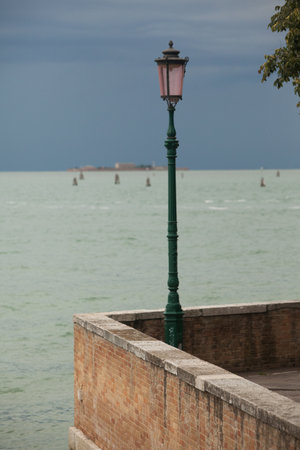 Lamppost on the promenade in Venice, Italyの写真素材