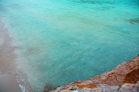 beautiful beach with turquoise water and rocks in Sardiniaの写真素材
