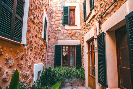 View of a medieval street in the Old Town of the picturesque Spanish-style village Fornalutx,...