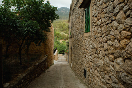View of a medieval street of the picturesque Spanish-style village Valdemossa in Majorca or Mallorca...