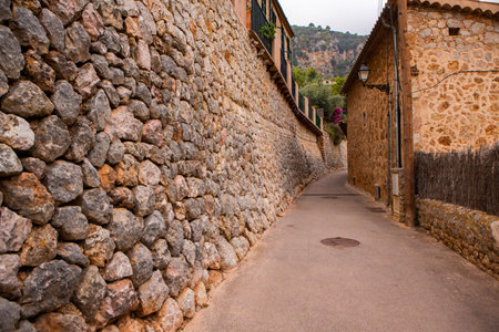 View of a medieval street of the picturesque Spanish-style village Valdemossa in Majorca or Mallorca island, Spain.の写真素材