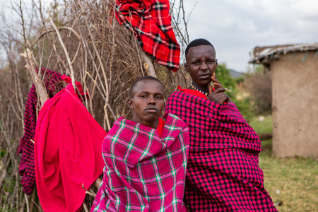 Unidentified Masai people in traditional clothes at Masai village, Kenia.のeditorial素材