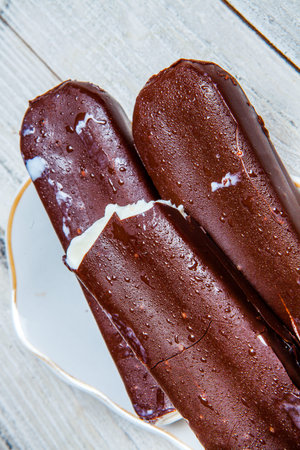 chocolate crepes on a white plate. style vintage. selective focus