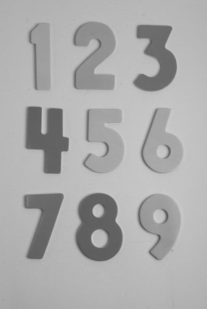 Numbers made from plasticine on a white background, closeup of photo