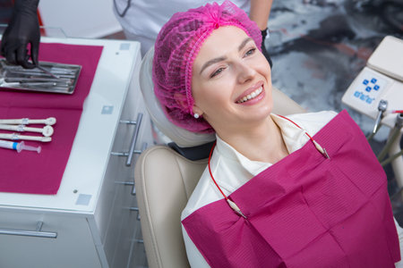 Stomatology and tooth care. Dentistry and oral health. Woman have teeth examination at dentistry clinic. Closeup young caucasian girl face.の写真素材