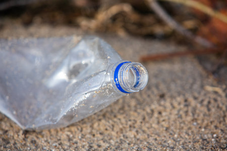 Plastic bottle left on the ground. Pollution environment concept.の写真素材