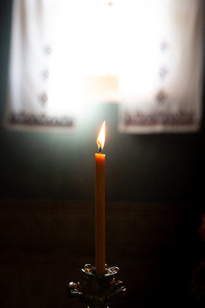 Burning candle in the Orthodox Christian Church. Shallow depth of field.の写真素材