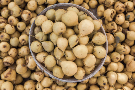 Chinese gooseberry fruit in a bowl on the market, Thailand.の写真素材